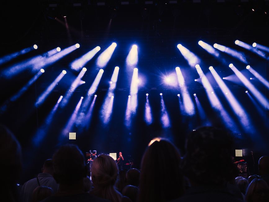 Lively crowd enjoying a concert s stunning stage lights